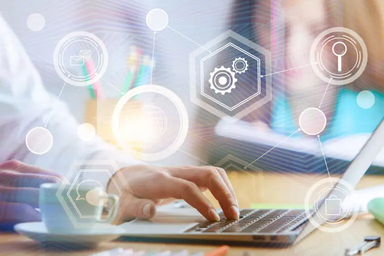 Close-up of a person pointing at a virtual screen filled with programming, cloud, and technology icons.